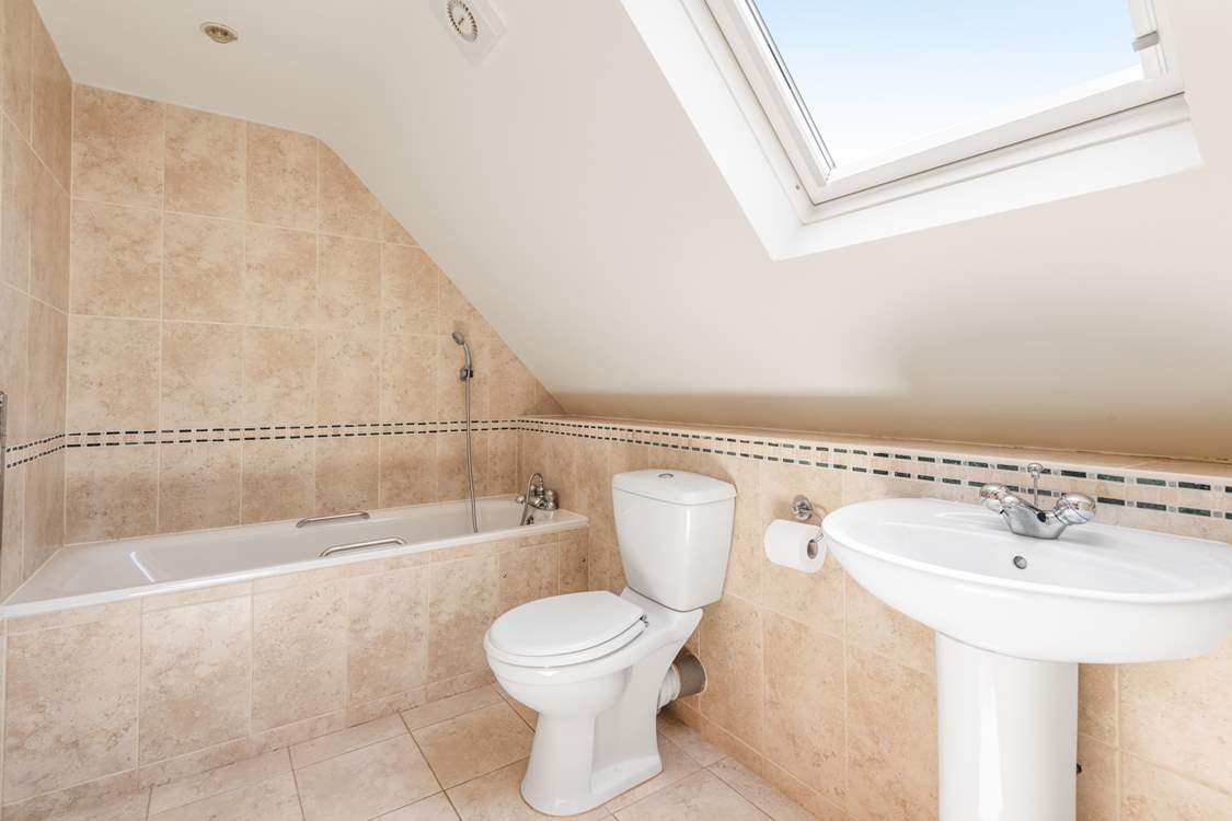 Relax in the gorgeous family bathroom.