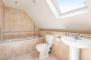 Relax in the gorgeous family bathroom.