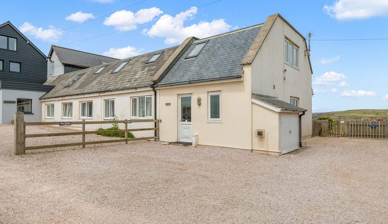 Your parking space can be found next to the entrance to Sea Poppy.