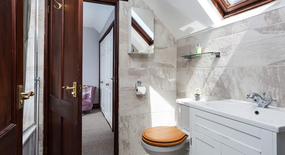 There is a Jack and Jill bathroom, shared by both bedrooms.