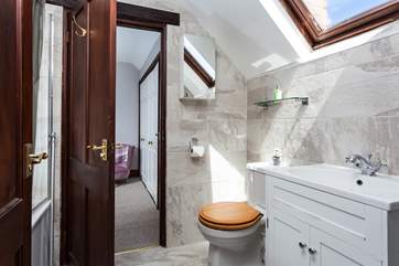 There is a Jack and Jill bathroom, shared by both bedrooms.