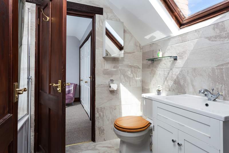 There is a Jack and Jill bathroom, shared by both bedrooms.