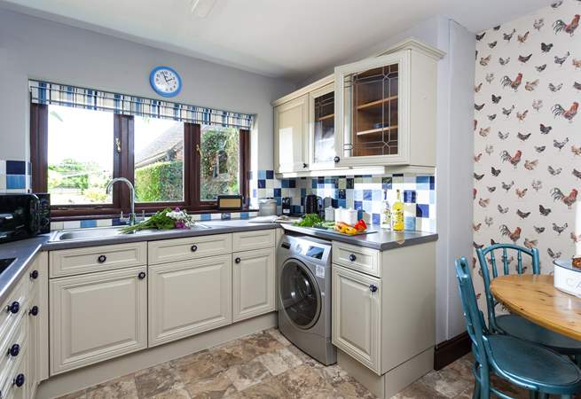 The homely kitchen area has everything you'll need.
