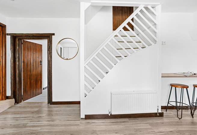 Stairs from the kitchen leading up to bedroom five.