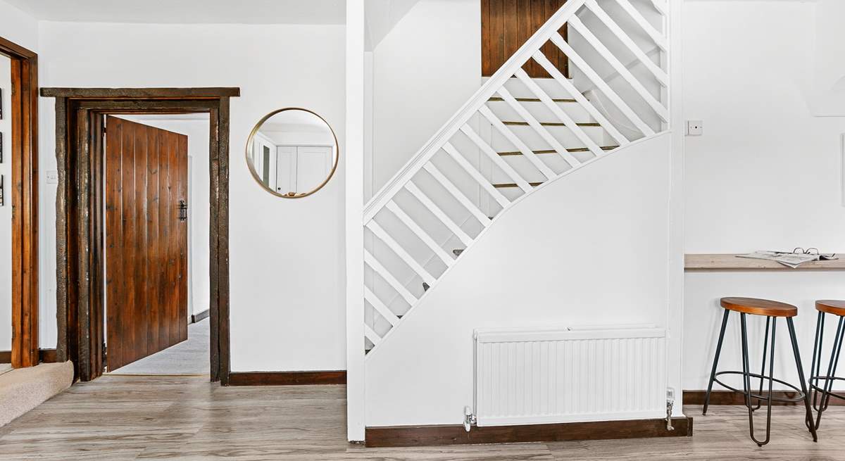 Stairs from the kitchen leading up to bedroom five.