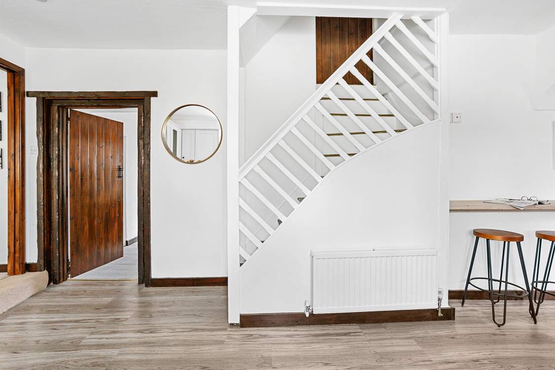 Stairs from the kitchen leading up to bedroom five.