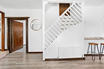 Stairs from the kitchen leading up to bedroom five.