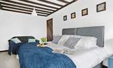 Bedroom five houses another 'zip and link' super-king with a chic en suite. - Thumbnail Image