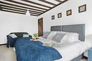Bedroom five houses another 'zip and link' super-king with a chic en suite.