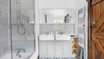 Bedroom 5 enjoys a wonderful en suite with a double vanity unit!