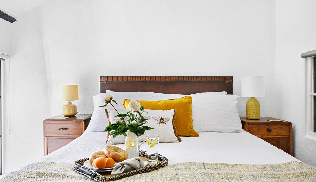 A gorgeous double bed sits in the centre of bedroom 6.