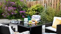 The patio at the rear of the house is perfect for al fresco dining.