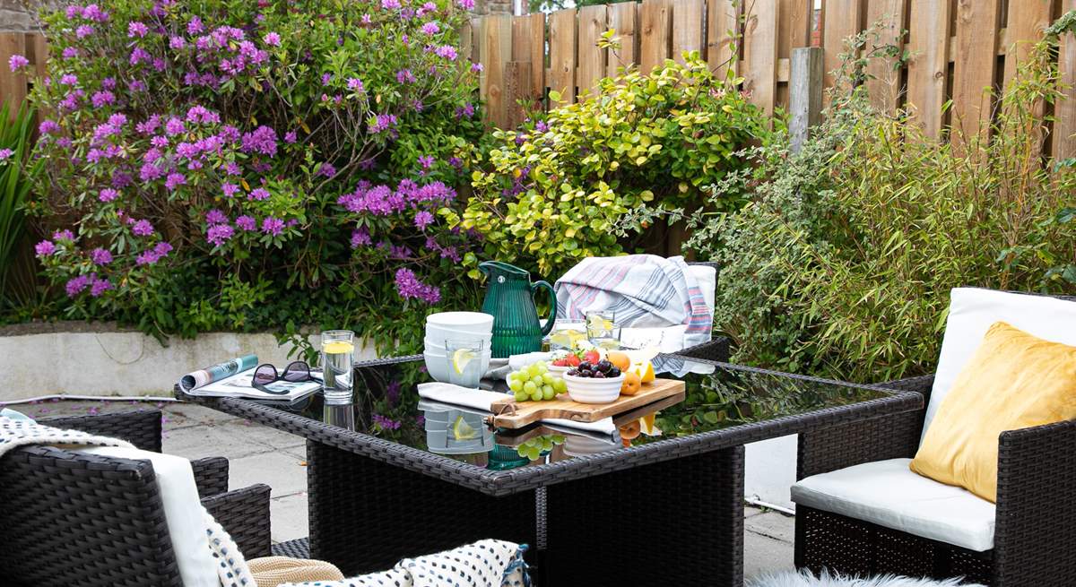 The patio at the rear of the house is perfect for al fresco dining.