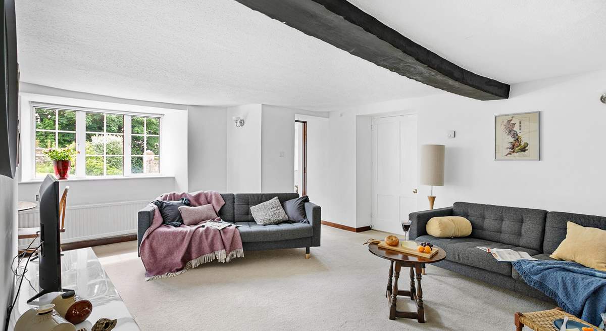 A gorgeous wooden beam runs across the second sitting-room's ceiling.