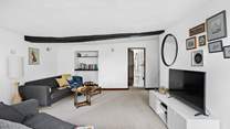 This room comes equipped with a fabulous Smart TV and leads to the second kitchen along with bedroom one and two.