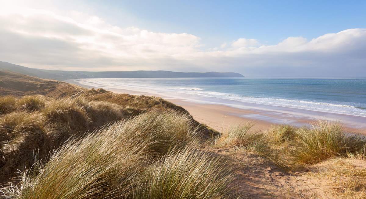 Enjoy the sand dunes at Woolacombe, a former Britain's best beach winner.