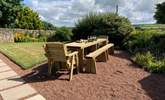 Enjoy the sunshine on the newly added wooden dining area. - Thumbnail Image