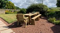 Enjoy the sunshine on the newly added wooden dining area.