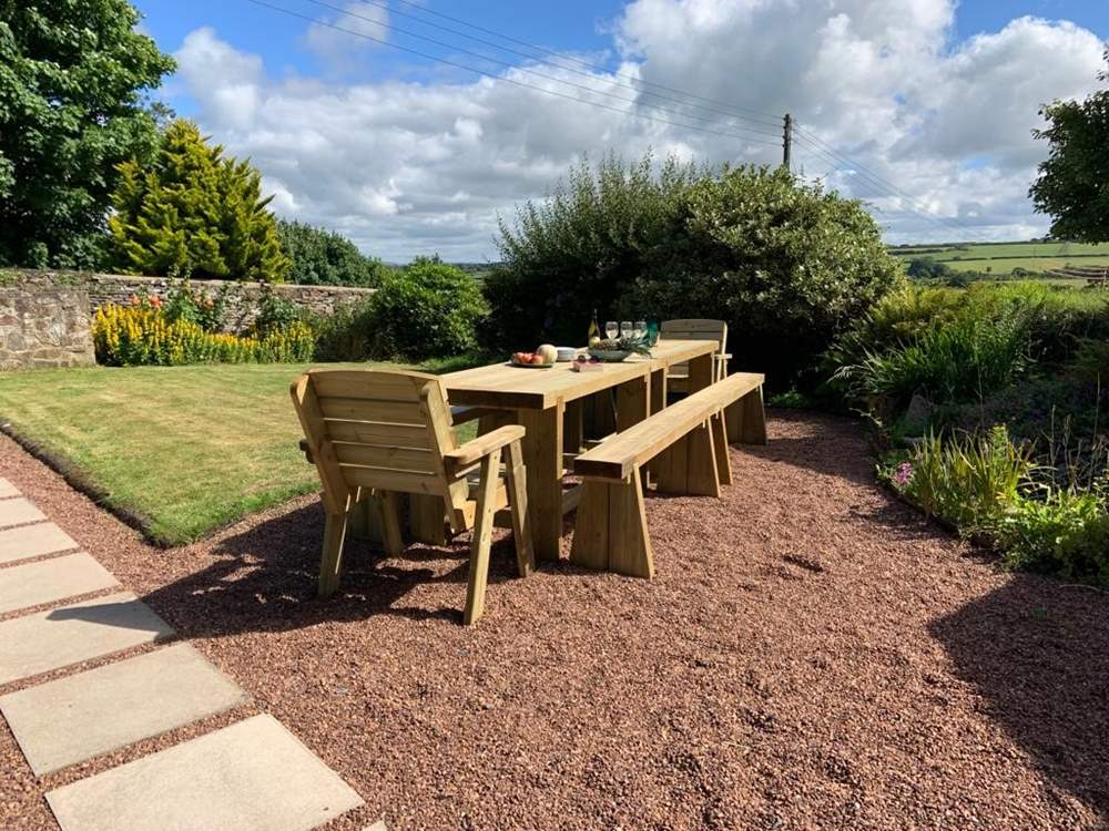 Enjoy the sunshine on the newly added wooden dining area.