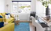 Decorated in nautical whites and blues, the yellow sofa bring a splash of colour. - Thumbnail Image