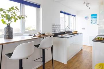 Making the most of its elevated position, the open plan living space has sea views from every window.