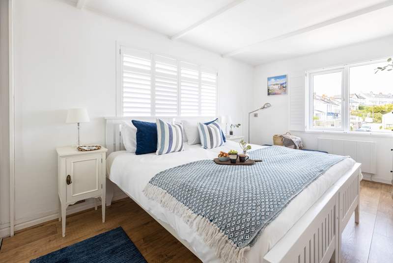 The gorgeous bedroom has a super-king size bed and a view towards Gull Rock.