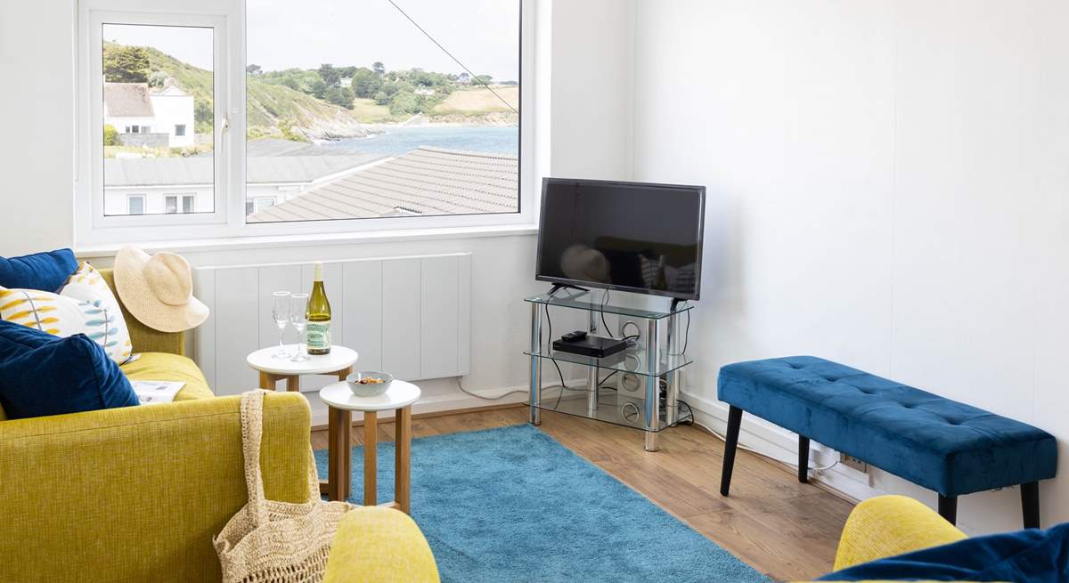 Drink in the view of Porthcurnick beach from the sofa.