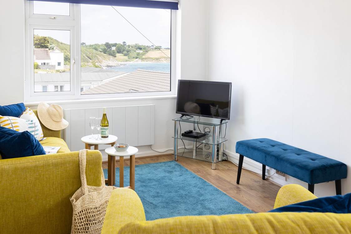 Drink in the view of Porthcurnick beach from the sofa.