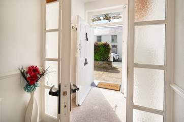 Wander through the airy entrance hall, perfect for storing your muddy boots after exploring.