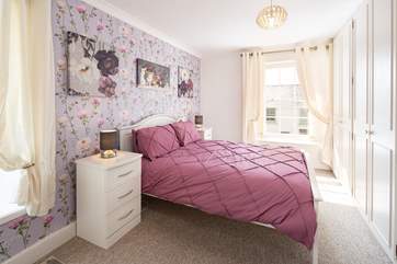 Bedroom two is wonderfully light thanks to some gorgeous windows.