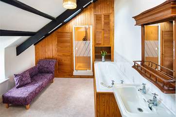The luxurious family bathroom is the perfect spot to relax.