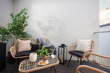 Relax and unwind on the private balcony.