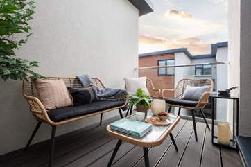 Enjoy evening drinks on the balcony.