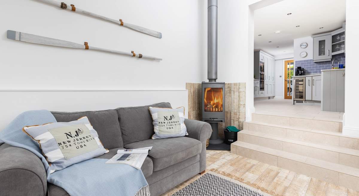 Down a short flight of steps from the kitchen you will find the gorgeous snug with super comfy sofa and wood-burner.