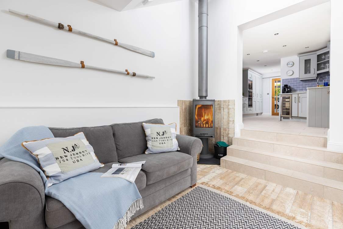Down a short flight of steps from the kitchen you will find the gorgeous snug with super comfy sofa and wood-burner.