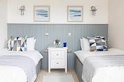 Pretty bedrooms await.