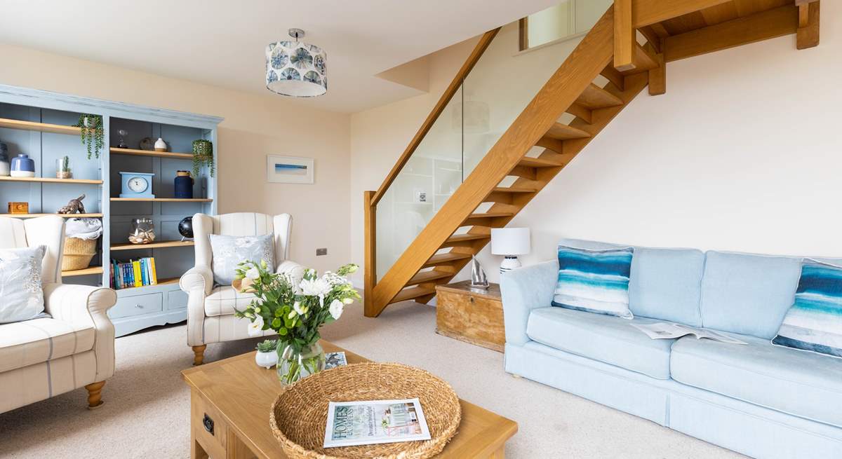 The feature glass balustrade staircase leads to bedroom three.