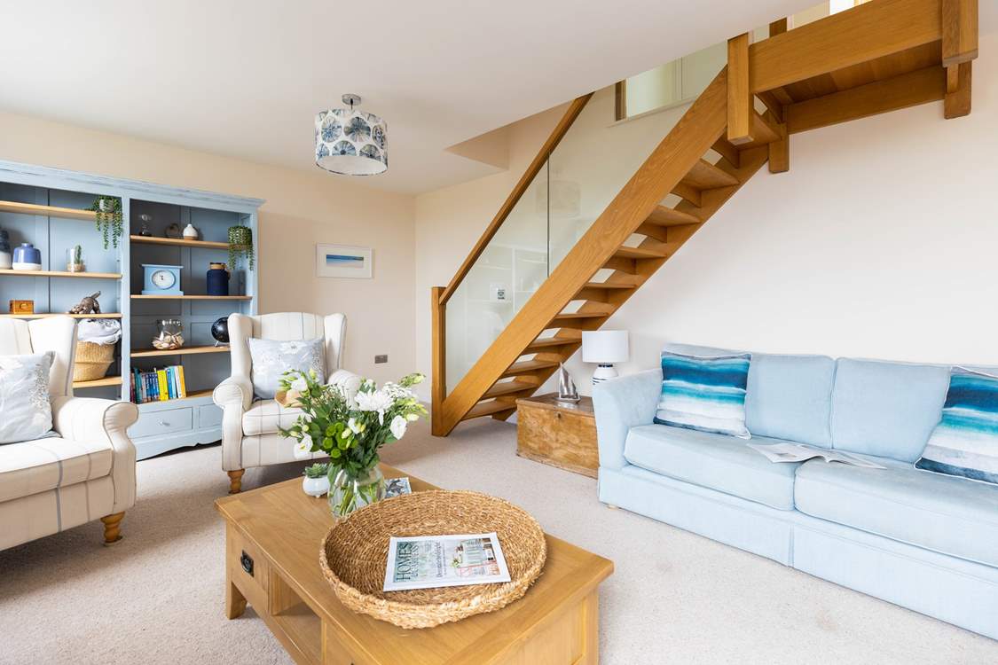 The feature glass balustrade staircase leads to bedroom three.