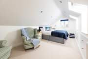 Bedroom 3 is on the first floor with a comfy king-size bed and views towards the sea.