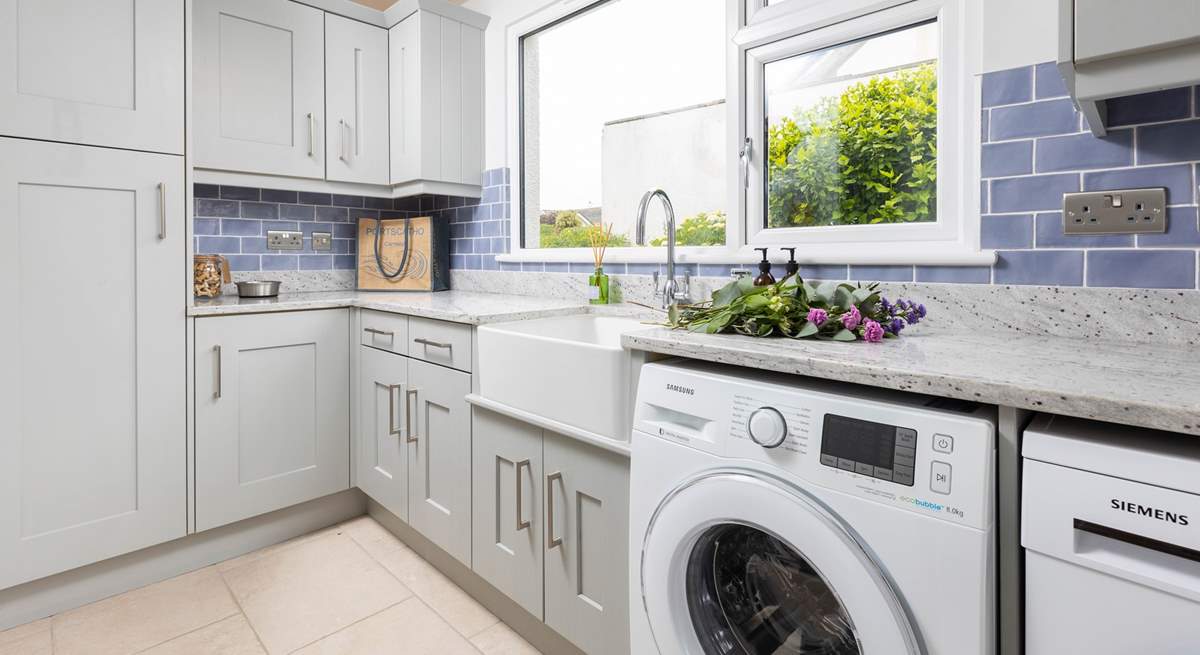 The handy utility-room off the kitchen has a washing machine and drier.