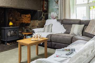 Enjoy a tasty treat on the sofa (please be aware that the fire is decorative only).
