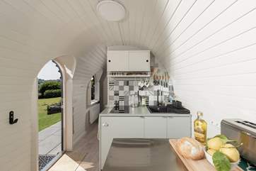 Open up the front door and enjoy the crisp evening breeze while you cook. The little kitchen has everything you need for cooking tasty holiday meals.