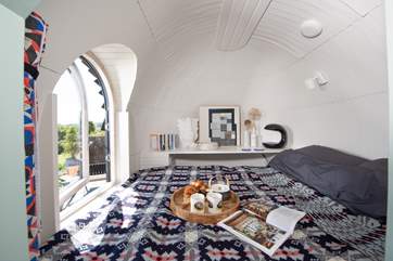 Snuggle up in bed together and look out at the far reaching views.