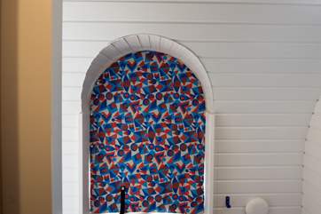 The owner has made these clever pop-on blinds to keep the sun out for those all-important holiday lie-ins.