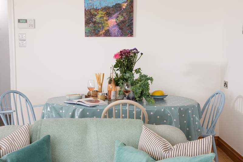 The dining-table sits behind the sofa, the perfect place to chat about the day's adventures.