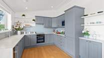 The super sleek kitchen has all the equipment you'll need.