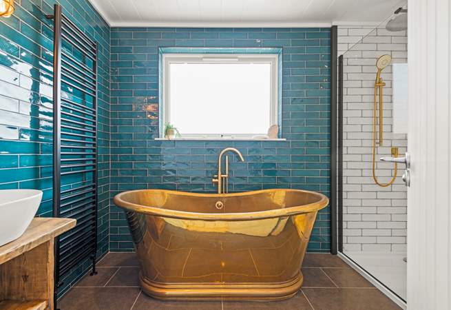 The en suite Bathroom has this fabulous roll-top bath and a stunning rainfall shower.