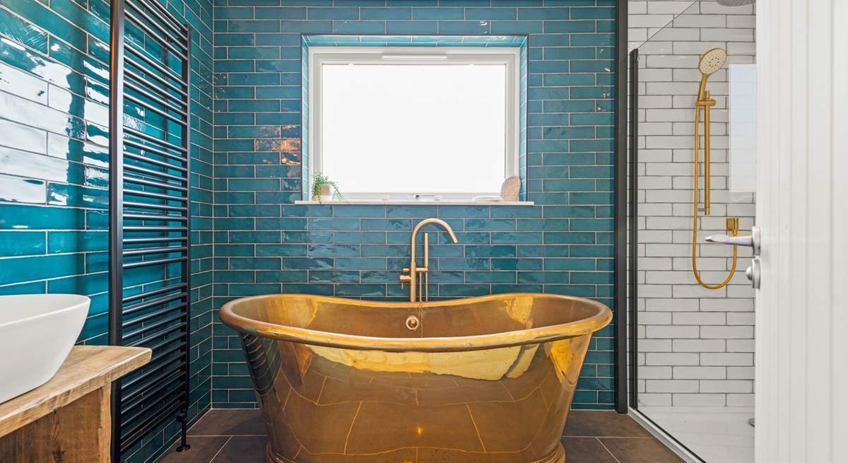 The en suite Bathroom has this fabulous roll-top bath and a stunning rainfall shower.