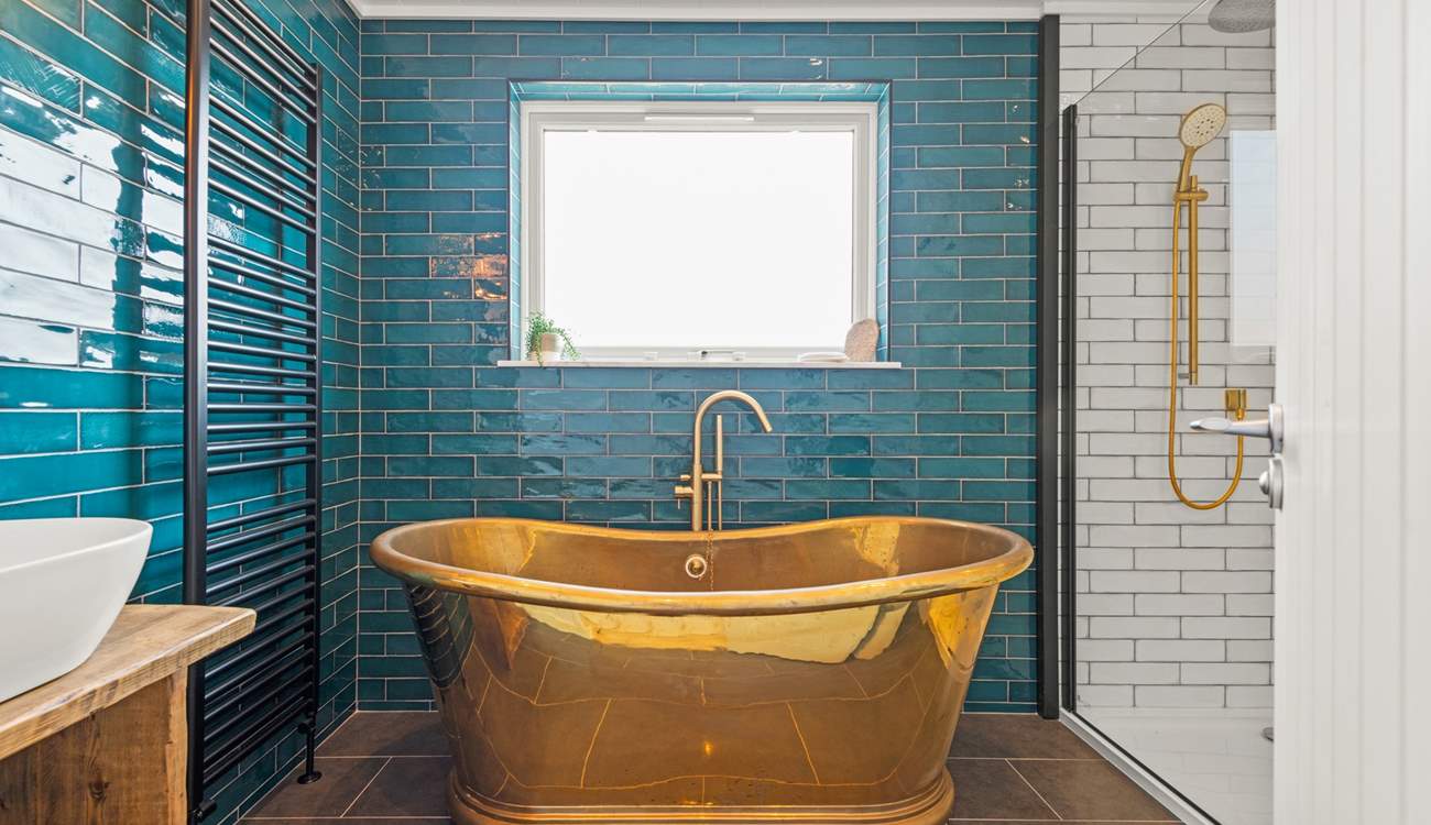 The en suite Bathroom has this fabulous roll-top bath and a stunning rainfall shower.