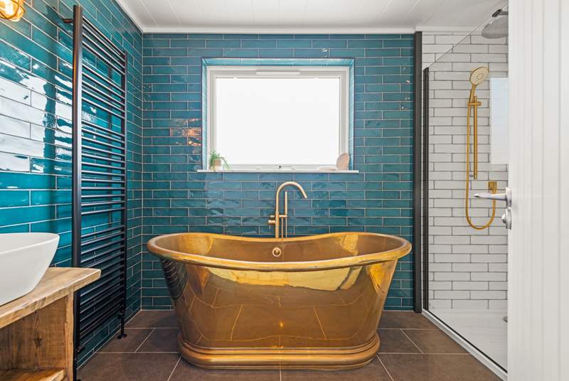 The en suite Bathroom has this fabulous roll-top bath and a stunning rainfall shower.